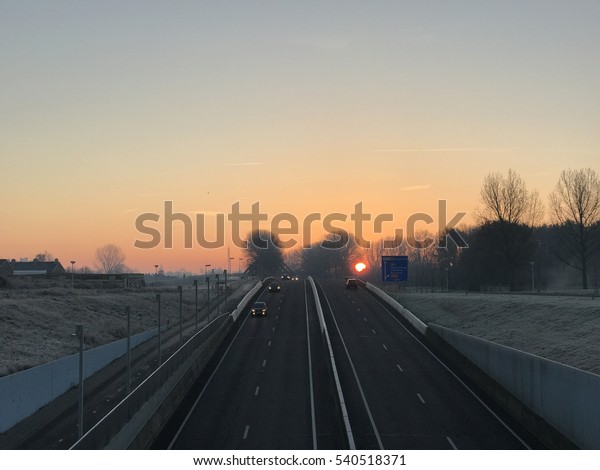 Sunrise above\
the highway in Sneek The\
Netherlands