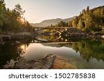 A sunrise across Belton Bridge over Middle Fork Flathead River near West Glacier in Glacier National Park, Montana, USA