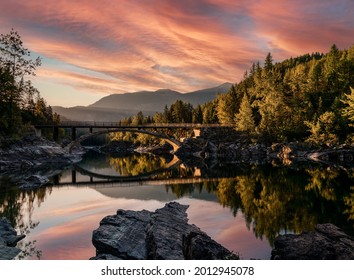 A sunrise across Belton Bridge over Middle Fork Flathead River near West Glacier in Glacier National Park, Montana, USA - Powered by Shutterstock