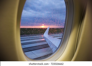 Sunrise Aerial View Through Business Jet Window Over Wings