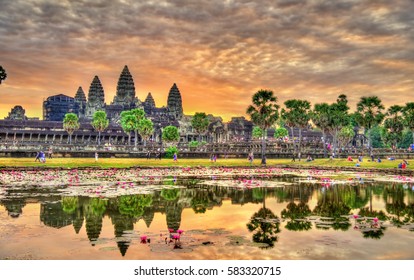 Sunrise at Angkor Wat, a UNESCO world heritage site in Cambodia. Built in the 12th century, it is the largest religious monument in the world. - Powered by Shutterstock