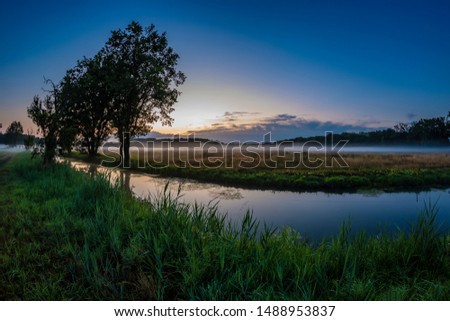 sunrise in autumn on a small river