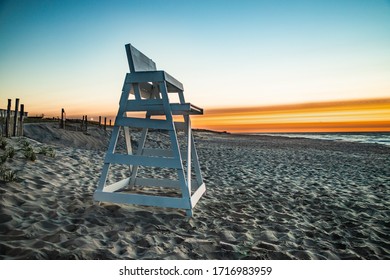 Sunrise at Beach Haven, NJ with the lone witness an empty lifeguard chair