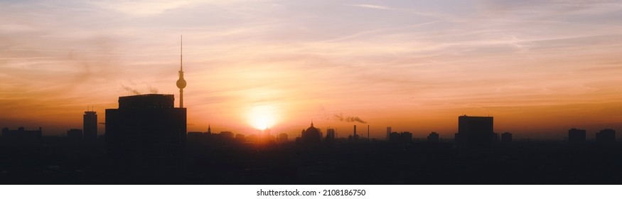 Sunrise in Berlin. Backlit Cityscape view of the berlin Skyline in the Morning.
