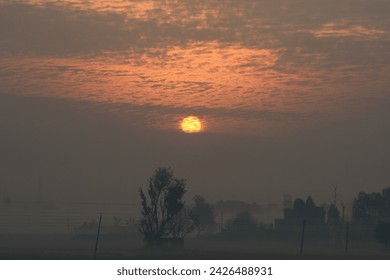 sunrise between amazing clouds and fields 