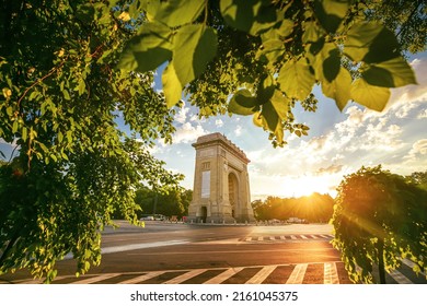 Sunrise in Bucharest with view to Arch of Triumph landmark building. Amazing color in the morning. Travel to Romania.