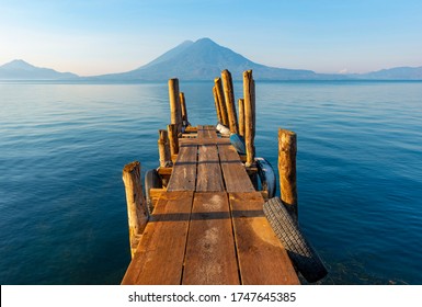 Sunrise by the Atitlan Lake with an embarkation pier, Panajachel, Guatemala. - Powered by Shutterstock