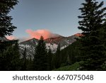 Sunrise in the Colorado Rocky Mountains.  A fiery sunrise over Blanca Peak, a rugged mountain in the Sangre de Cristo range of Southern Colorado