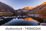 Sunrise at Convict Lake, part of California Eastern Sierra. Nice water reflection and golden fall foliage.