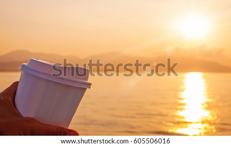 Sunrise with cup of coffee