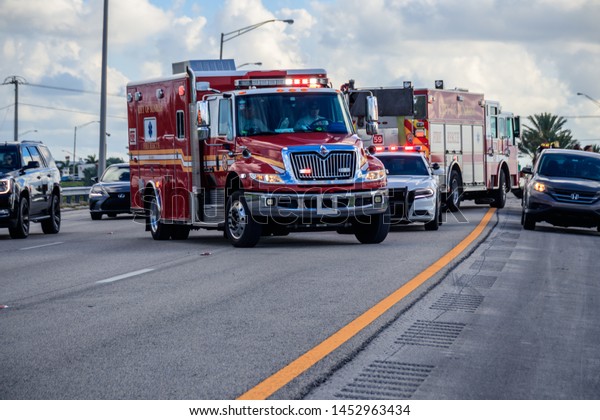 Sunrise, FloridaUSA - July 16, 2019: Car Accident,\
some peoples was injured, three cars was smashed. Police Officer\
investigate accident. Sunrise Fire-Rescue Department workers\
maintained scene.