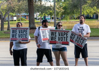 Sunrise, Florida/USA - November 26, 2019: Democratic Party supporters holds Anti-Trump signs, flags and symbols in the crowd. Peoples against Donald J. Trump. Trump Impeachment Signs. 