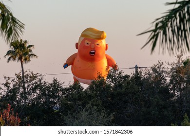 Sunrise, Florida/USA - November 26, 2019: Democratic Party anti-Trump meeting. Donald Trump Baby Ballon in the sky.