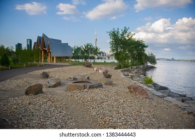 Sunrise Garden Pavilion at Trillium Park in Toronto, Canada. The provincial park was developed along Lake Ontario. In background the Toronto skyline with the CN Tower is visible.