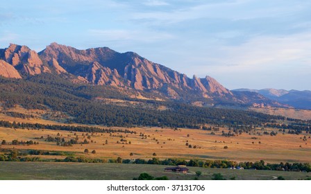 Sunrise hits the Flatirons and Bear Mountain next to Boulder, Colorado