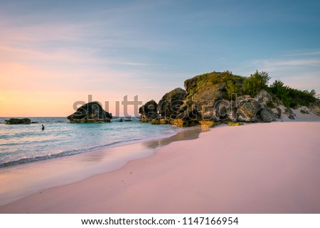 Sunrise at Horse Shoe Bay in South Hampton, Bermuda with an early riser swimmer Сток-фото © 