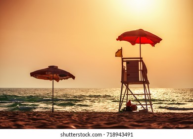 Sunrise with life guard station silhouette. Varna beach, Bulgaria. - Powered by Shutterstock