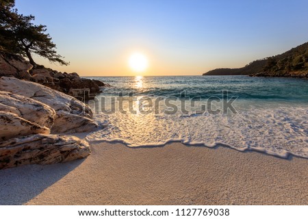 Sunrise in Marble beach (Saliara beach), Thassos Island, Greece. The most beautiful white beach in Greece