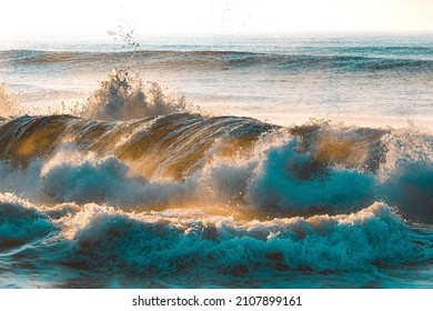 Sunrise, Massive Powerful sea waves crashing on the beach. Stormy sea waves on the seashore