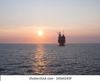 Sunrise At An Offshore Oil Platform On The North Sea, In The Norwegian Sector