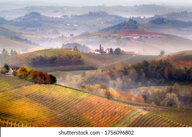 Sunrise on Barolo lands and fog in Langhe Region, Piemonte Piedmont. Unesco World Heritage site in Northern Italy. Agriculture Vineyards and Wine production. - Powered by Shutterstock