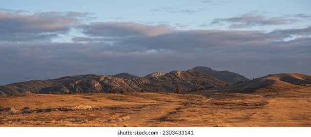 Sunrise on an empty valley amazing hilly landscape. Colorful grassy and hilly natural landscape in autumn. Beautiful autumn scenery in Inner Mongolia, China. - Powered by Shutterstock