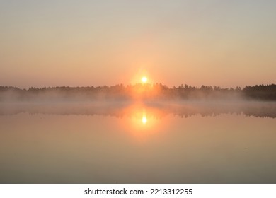 Sunrise On A Forest Lake. Beautiful Foggy Morning Nature Landscape. Calm Scene. Dawn, Mist, Calm Water