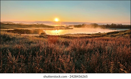 Sunrise on the golf course with fog and mist in a pond - Powered by Shutterstock