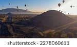 Sunrise on hot air balloon over the Teotihuacan pyramid