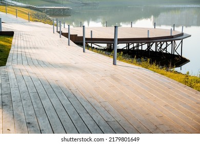 Sunrise On The Lake, Wooden Pier By The Water, Private Road House By The Lake, Boat Mooring, Morning Light, No People, City Park, Landscaping. High Quality Photo