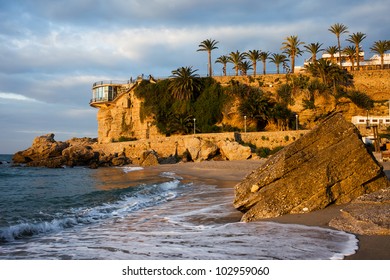 Sunrise on the picturesque coastline of the Mediterranean Sea and Balcon de Europa famous vantage point in resort town of Nerja, Costa del Sol, Spain.