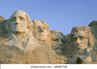 Sunrise on Presidents George Washington, Thomas Jefferson, Teddy Roosevelt and Abraham Lincoln at Mount Rushmore National Memorial, South Dakota - Powered by Shutterstock