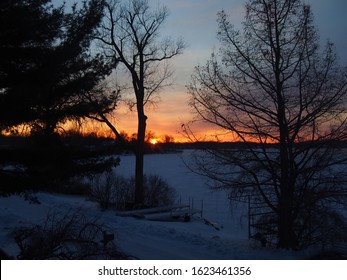 Sunrise on snow covered Lake Lansing