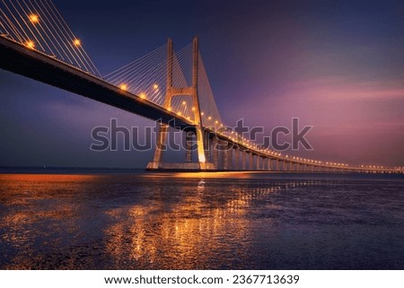 sunrise on Vasco da Gama bridge in Lisbon, Portugal 