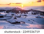 Sunrise on Velika Planina in winter.