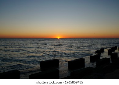 Sunrise orange light at lake Michigan Promontory Point - Shutterstock ID 1965859435
