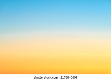 Sunrise orange-blue sky gradient, clear sky without clouds. Beautiful red and light blue sky, copy space for text