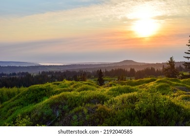 Sunrise Over Alaska Landscape With Fields And Mountains