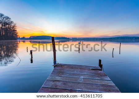 Sunrise over beautiful lake in Mazury lake district. Morning in Poland. Lake alndscape at sunrise