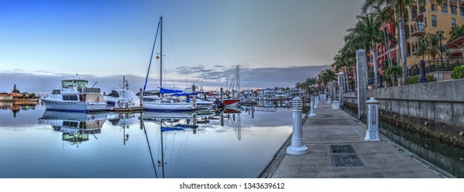 Sunrise over the boats in Esplanade Harbor Marina in Marco Island, Florida