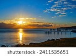 Sunrise over Chesapeake Bay and fishing piers 
