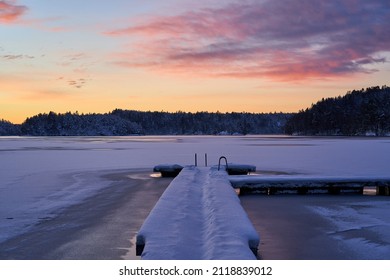 Sunrise over Delsjön the day after a snowfall. Delsjön is a beautiful lake near Gothenburg, Sweden.                        