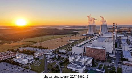 Sunrise over the Dukovany nuclear power plant with cooling towers in the Czech Republic - Shutterstock ID 2274488243