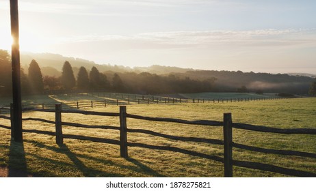 Sunrise Over Fenced Farm Land, Kent Downs. 