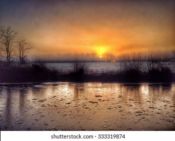 Sunrise Over Frozen Leeds And Liverpool Canal Near Wigan