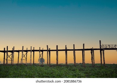 Sunrise over the historic wooden U Bein Bridge with foggy sky near Mandalay in Myanmar (Burma)
 - Shutterstock ID 2081886736
