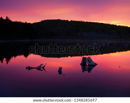 Similar – schöner Sonnenaufgang über dem See mit Pier und Yachten