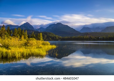 The sunrise over a lake in the park High Tatras. Strbske Pleso, Slovakia, Europe.