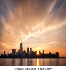 Sunrise Over Lower Manhattan, New York City. Sun Behind The Buildings Of The Financial District During Early Morning.