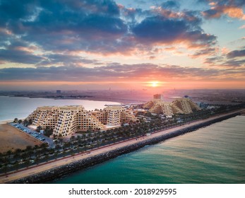 Sunrise over Marjan Island seafront reclaimed land artificial island in emirate of Ras al Khaimah in the United Arab Emirates aerial view